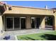 Covered patio with pavers and artificial turf, great for outdoor living and entertainment at 32 Feather Sound Dr, Henderson, NV 89052