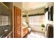 Bright bathroom with a shower, storage cabinet and window allowing natural light in at 325 Wild Plum Ln, Las Vegas, NV 89107