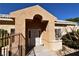 Inviting front entrance featuring a gate and stucco exterior for added curb appeal at 325 Wild Plum Ln, Las Vegas, NV 89107