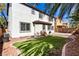 Charming backyard featuring a well-maintained artificial lawn and easy access to the home at 3305 Alcudia Bay Ave, Las Vegas, NV 89141