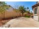 The backyard offers a mix of concrete patio space and natural landscaping, perfect for outdoor living at 3305 Alcudia Bay Ave, Las Vegas, NV 89141