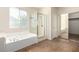 Bathroom featuring separate tub and shower, and large window at 3305 Alcudia Bay Ave, Las Vegas, NV 89141
