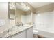 Bright bathroom featuring granite countertop, modern fixtures, and a shower-tub combination at 3305 Alcudia Bay Ave, Las Vegas, NV 89141