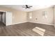 Empty, sunny bedroom with hardwood floors, ceiling fan and natural light at 3305 Alcudia Bay Ave, Las Vegas, NV 89141