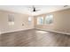 Spacious bedroom with ceiling fan, hardwood floors, and natural light at 3305 Alcudia Bay Ave, Las Vegas, NV 89141