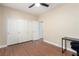 Bedroom featuring wood-look flooring, a ceiling fan, and closet with sliding doors at 3305 Alcudia Bay Ave, Las Vegas, NV 89141