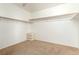 Walk-in closet with carpet, wood shelving and ample storage space at 3305 Alcudia Bay Ave, Las Vegas, NV 89141