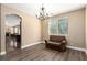 Dining room features chair rail and vinyl floors with arched access to living room at 3305 Alcudia Bay Ave, Las Vegas, NV 89141