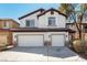 Charming two-story home with a three-car garage and desert landscaping at 3305 Alcudia Bay Ave, Las Vegas, NV 89141