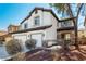 Charming two-story home with a three-car garage, stone accents, and a well-manicured front yard at 3305 Alcudia Bay Ave, Las Vegas, NV 89141