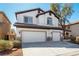 Charming home with a double garage and tile roof, complemented by desert-friendly landscaping at 3305 Alcudia Bay Ave, Las Vegas, NV 89141