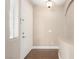 Neutral foyer with tile flooring features a coat closet and built-in bench at 3305 Alcudia Bay Ave, Las Vegas, NV 89141