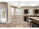 Bright kitchen featuring a stainless steel sink and access to an outdoor door at 3305 Alcudia Bay Ave, Las Vegas, NV 89141