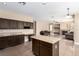 Open kitchen with a large island, modern appliances, and access to the living room at 3305 Alcudia Bay Ave, Las Vegas, NV 89141