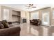 Open-concept living room featuring natural light and a decorative fireplace at 3305 Alcudia Bay Ave, Las Vegas, NV 89141
