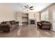 Spacious living room with a fireplace, tile floors and ample seating at 3305 Alcudia Bay Ave, Las Vegas, NV 89141