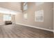 Sunlit living room with high ceilings and luxury vinyl plank flooring at 3305 Alcudia Bay Ave, Las Vegas, NV 89141