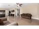 Cozy living room adjacent to the kitchen with neutral walls and tile flooring at 3305 Alcudia Bay Ave, Las Vegas, NV 89141