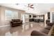 Bright living room flowing into a modern kitchen with stainless steel appliances at 3305 Alcudia Bay Ave, Las Vegas, NV 89141