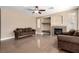 Spacious living room featuring a cozy fireplace and shiny tile flooring at 3305 Alcudia Bay Ave, Las Vegas, NV 89141