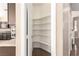Walk-in pantry with ample shelving space, located off the kitchen at 3305 Alcudia Bay Ave, Las Vegas, NV 89141
