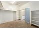 Spacious walk-in closet with carpet and open shelves, providing ample storage and organization options at 3305 Alcudia Bay Ave, Las Vegas, NV 89141