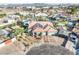 Aerial view of a single story home with mature landscaping, three-car garage, and covered parking at 3365 Badura Ave, Las Vegas, NV 89118