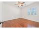 Bedroom featuring hardwood floors, plantation shutters, and a ceiling fan at 3365 Badura Ave, Las Vegas, NV 89118