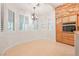 Eat-in breakfast nook with brick wall accent and natural light from shuttered windows at 3365 Badura Ave, Las Vegas, NV 89118
