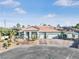 Single Gathering home featuring mature landscaping, a three car garage, and large driveway at 3365 Badura Ave, Las Vegas, NV 89118