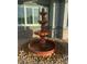 Close-up of a decorative fountain adding charm to the front yard landscaping at 3365 Badura Ave, Las Vegas, NV 89118