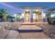 Inviting front entrance featuring walkway lights, a decorative fountain, and a well-maintained front yard at 3365 Badura Ave, Las Vegas, NV 89118