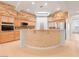 Modern kitchen with stone accents, stainless steel appliances, and tile flooring at 3365 Badura Ave, Las Vegas, NV 89118