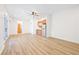 Bright, open living area with wood-style flooring, ceiling fan, and natural light at 3365 Badura Ave, Las Vegas, NV 89118