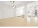 Spacious living area with tile flooring and modern light fixtures at 3365 Badura Ave, Las Vegas, NV 89118