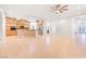 Open-concept living space showcasing the kitchen, stone accents, and tiled flooring at 3365 Badura Ave, Las Vegas, NV 89118