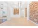 Bright, open living space with stone accent walls and tile flooring at 3365 Badura Ave, Las Vegas, NV 89118