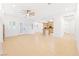 Open living space featuring a fireplace, tiled floors, and bright lighting at 3365 Badura Ave, Las Vegas, NV 89118