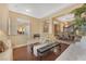 Inviting living room boasting hardwood accents and a seamless flow into the dining area at 3365 Badura Ave, Las Vegas, NV 89118