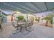 Outdoor dining area underneath a pergola with backyard views at 3365 Badura Ave, Las Vegas, NV 89118