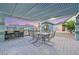 Charming outdoor dining area featuring a built-in BBQ and a shaded pergola at 3365 Badura Ave, Las Vegas, NV 89118
