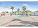 Backyard pool area with decorative palms and a well-designed patio at 3365 Badura Ave, Las Vegas, NV 89118