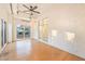 Sunroom with light hardwood floors and windows looking out into the backyard at 3365 Badura Ave, Las Vegas, NV 89118