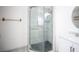 Fresh bathroom showcasing glass-door shower, white fixtures, and stylish tile at 3369 Milenko Dr, Las Vegas, NV 89121