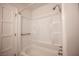 A clean, well-maintained bathroom with a shower-tub combination, complete with safety rails and storage shelves at 3369 Milenko Dr, Las Vegas, NV 89121