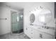 Renovated bathroom with double sinks, marble countertop, and glass-enclosed shower at 3369 Milenko Dr, Las Vegas, NV 89121