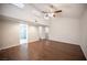 Bright bedroom featuring wood-look floors, a ceiling fan, and natural light at 3369 Milenko Dr, Las Vegas, NV 89121