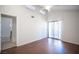 Inviting bedroom featuring hardwood floors, high ceilings, a ceiling fan, and sliding glass doors for natural light and outdoor access at 3369 Milenko Dr, Las Vegas, NV 89121