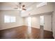 Bedroom showcasing wood-look floors, and multiple windows for natural light at 3369 Milenko Dr, Las Vegas, NV 89121