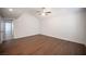 Spacious bedroom featuring wood-look floors, a ceiling fan, and a vaulted ceiling at 3369 Milenko Dr, Las Vegas, NV 89121